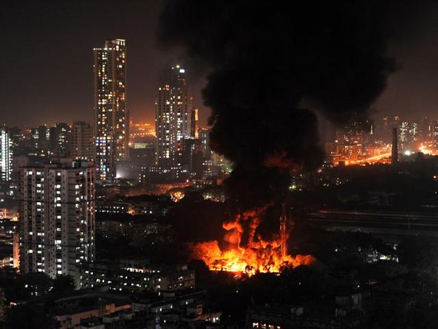 A massive fire broke out in a godown near Mauli Sadan building in Bora compound, Parel, on Tuesday. (Vijayanand Gupta/HT photo) A massive fire broke out in a godown near Mauli Sadan building in Bora compound, Parel, on Tuesday. (Vijayanand Gupta/HT photo)