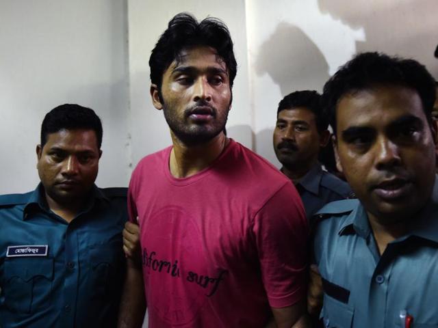 Bangladeshi cricketer Shahadat Hossain is taken away by policemen after he surrendered before a court in Dhaka. (AP Photo) Bangladeshi cricketer Shahadat Hossain is taken away by policemen after he surrendered before a court in Dhaka. (AP Photo)