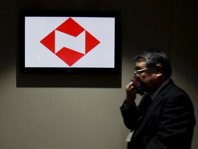 A man walks past a logo of Japanese life insurer Nippon Life at the company's headquarters in Tokyo. (Reuters Photo) A man walks past a logo of Japanese life insurer Nippon Life at the company's headquarters in Tokyo. (Reuters Photo)