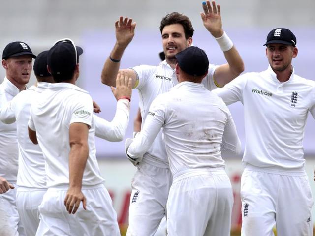 England’s bowler Steven Finn, second from left, celebrates with teammates after dismissing South Africa’s batsman Faf du Plessis on the fourth day of the match between South Africa and England.(AP Photo)