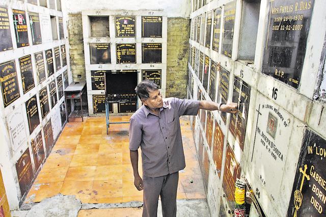 Mahadev More, the gravedigger at the Thane cemetery said the bodies are being wrapped in cloth so that they decompose faster and free up graves. (Praful Gangurde)