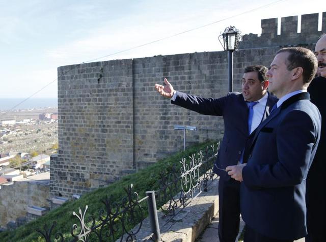 (FILES) A file picture taken on November 13, 2015 shows Russian Prime Minister Dmitry Medvedev (2nd R) listening to explanations on a tour of the Naryn-Kala Fortress in Derbent. One person was killed and 11 were injured in a shooting at a UNESCO heritage site in Russia's volatile North Caucasus region of Dagestan, local health authorities said on December 30, 2015. (AFP) (FILES) A file picture taken on November 13, 2015 shows Russian Prime Minister Dmitry Medvedev (2nd R) listening to explanations on a tour of the Naryn-Kala Fortress in Derbent. One person was killed and 11 were injured in a shooting at a UNESCO heritage site in Russia's volatile North Caucasus region of Dagestan, local health authorities said on December 30, 2015. (AFP)