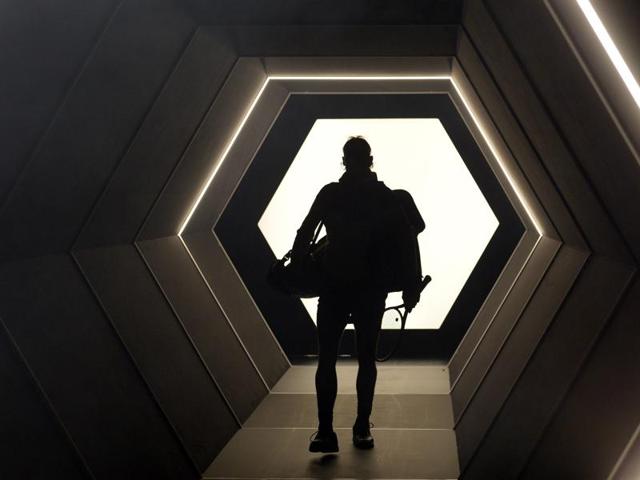 Spain's Rafael Nadal is silhouetted as he arrives on court for his second-round match against Czech Republic's Lukas Rosol at the Paris Masters. How about that for an entry? (AFP Photo) 
