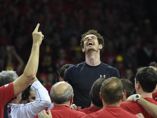 Andy Murray, saviour of British sport: Andy Murray (C) celebrates with teammates after Britain won the Davis Cup for the first time since 1936. (AFP Photo) 