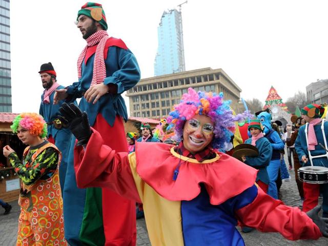Street artists perform during a New Year's parade in the Georgian capital Tbilisi. New Year's is the biggest holiday of the year in Russia and former Soviet Union, followed by Orthodox Christmas celebrated on January 7. (AFP / VANO SHLAMOV)