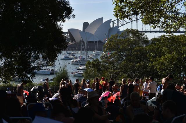 People wait at the Mrs Macquarie chair to watch the New Year fireworks over the Sydney harbour on December 31, 2015. (AFP) People wait at the Mrs Macquarie chair to watch the New Year fireworks over the Sydney harbour on December 31, 2015. (AFP)