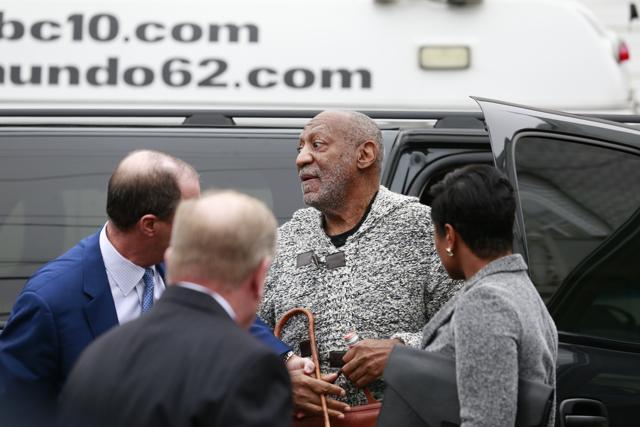 Actor and comedian Bill Cosby is helped as he leaves after a court appearance, Wednesday, Dec. 30, 2015, in Elkins Park, Pa. Cosby was arrested and charged with drugging and sexually assaulting a woman at his home in January 2004. (AP)