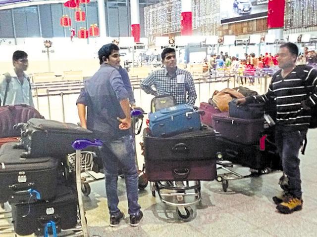 A group of students wait after being stopped at the Rajiv Gandhi International Airport in Hyderabad from boarding a US-bound flight on December 22. (File Photo) A group of students wait after being stopped at the Rajiv Gandhi International Airport in Hyderabad from boarding a US-bound flight on December 22. (File Photo)