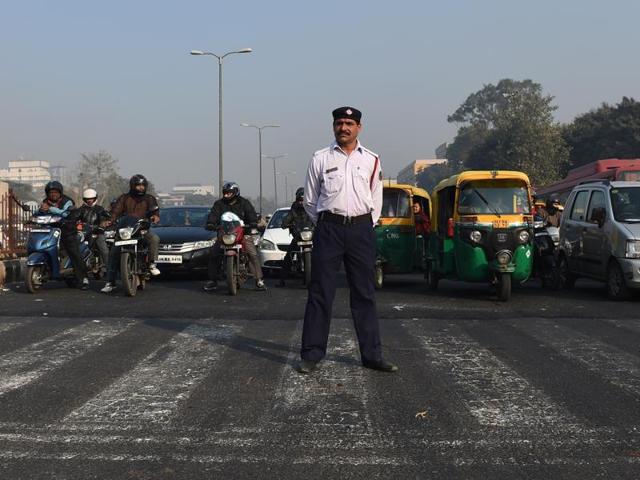 Commuters on motorbikes are seen at a traffic intersection in New Delhi on December 31, 2015. All eyes are on Delhi to see if it’s new odd-even scheme will work.(AFP Photo) Commuters on motorbikes are seen at a traffic intersection in New Delhi on December 31, 2015. All eyes are on Delhi to see if it’s new odd-even scheme will work.(AFP Photo)