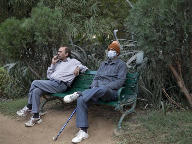 Man wearing mask to protect himself from pollution as he sits at the Lodhi garden, New Delhi. Over the last decade the city's air pollution has grown so rapidly that the cold weather turns the city into a grey, smog-filled health nightmare. New Delhi has earned the dubious distinction of being the world's dirtiest city, surpassing Beijing, once the poster child for air pollution. (Tsering Topgyal/AP Photo)