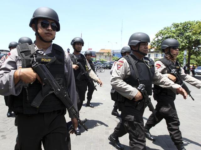 Police officers are deployed to secure New Year celebrations in Bali, Indonesia. Indonesia is on high alert after authorities said last week that they had foiled a plot by Islamic militants to attack government officials, foreigners and others in the world's most populous Muslim nation. (AP Photo/Firdia Lisnawati)