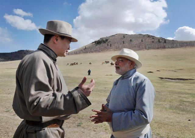 Prime Minister Narendra Modi talking with his Mongolian counterpart Chimed Saikhanbileg during the Mini Naadam festival in Ulan Bator, Mongolia. (PTI) Prime Minister Narendra Modi talking with his Mongolian counterpart Chimed Saikhanbileg during the Mini Naadam festival in Ulan Bator, Mongolia. (PTI)