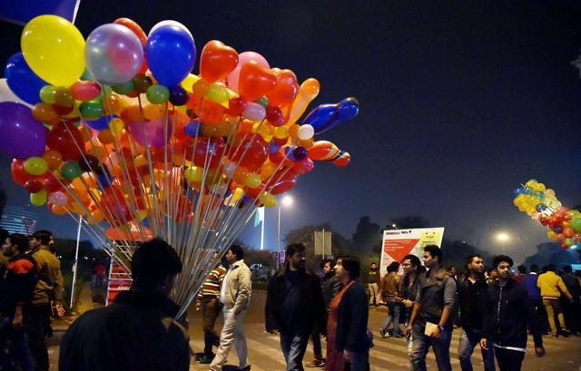 Revelers at CP on the eve of New Year in New Delhi on Thursday. (PTI) Revelers at CP on the eve of New Year in New Delhi on Thursday. (PTI)
