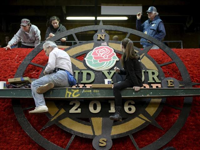 Volunteers work on a Rose Parade float in preparation for the parade in Pasadena, California. The 127th Rose Parade will take place on New Year's Day in Pasadena. (REUTERS/Kevork Djansezian)