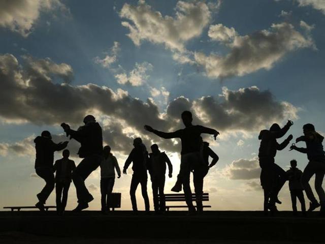 Palestinians celebrate the last day of the year at the sea port in Gaza City. (AFP Photo) Palestinians celebrate the last day of the year at the sea port in Gaza City. (AFP Photo)