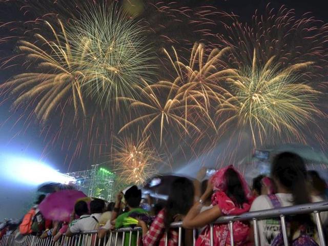 Revelers watch as fireworks explode during New Year celebrations outside the Philippine Arena in Bocaue town, Bulacan province, north of Manila. (Reuters) Revelers watch as fireworks explode during New Year celebrations outside the Philippine Arena in Bocaue town, Bulacan province, north of Manila. (Reuters)