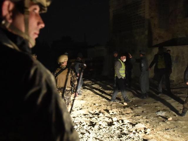 Security personnel and bystanders look on as flames and smoke rise at the site of a suicide car bomb attack at a French restaurant- Le Jardin in Kabul. (AFP Photo) Security personnel and bystanders look on as flames and smoke rise at the site of a suicide car bomb attack at a French restaurant- Le Jardin in Kabul. (AFP Photo)