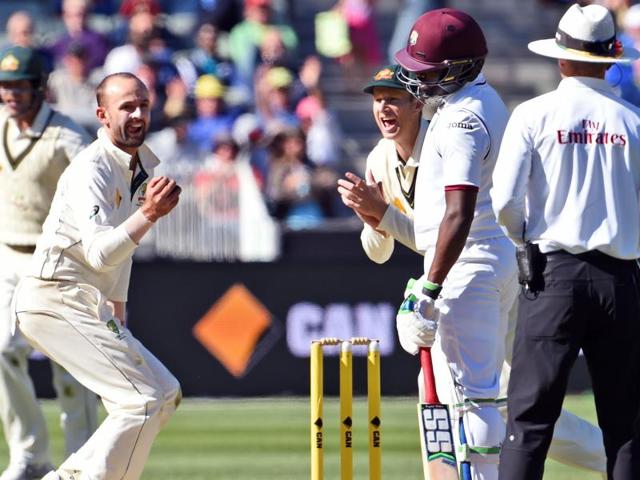 Australian spinner Nathan Lyon dives in an attempt to catch West Indies batsman Rajendra Chandrika on the second day of the second cricket Test in Melbourne. (AFP Photo) Australian spinner Nathan Lyon dives in an attempt to catch West Indies batsman Rajendra Chandrika on the second day of the second cricket Test in Melbourne. (AFP Photo)