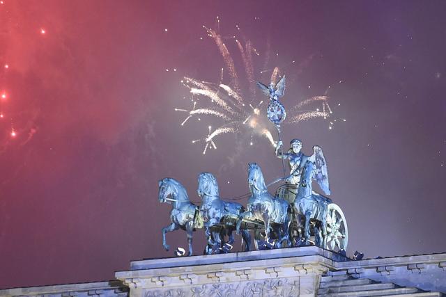 Fireworks explode behind the quadriga of Berlin's Brandenburg Gate to usher in the new year. (AFP) Fireworks explode behind the quadriga of Berlin's Brandenburg Gate to usher in the new year. (AFP)