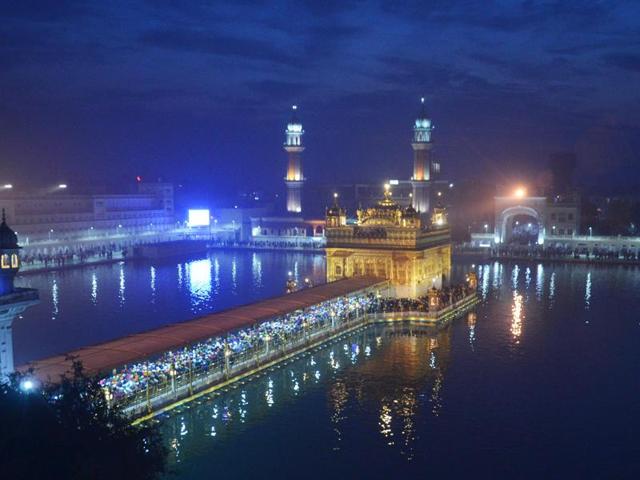 A beautiful picture of the Golden Temple, lit in beautiful colours to mark the New Year 2016. (Sameer Sehgal/HT Photo)