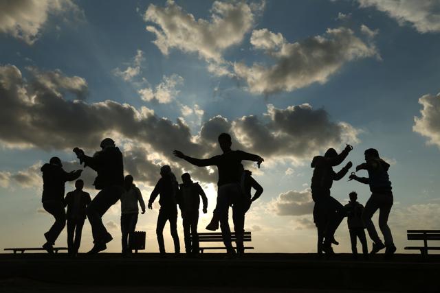 Palestinians celebrate the last day of the year at the sea port in Gaza City. (AFP) Palestinians celebrate the last day of the year at the sea port in Gaza City. (AFP)