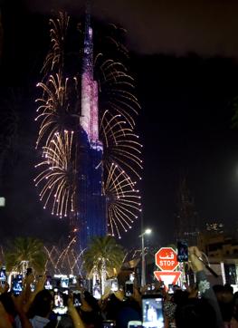 Fireworks illuminate the Burj Khalifa as the Hotel Address Downtown burns behind it (AFP) Fireworks illuminate the Burj Khalifa as the Hotel Address Downtown burns behind it (AFP)