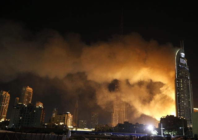 Smoke billows from the Address Downtown Hotel. (AFP Photo) Smoke billows from the Address Downtown Hotel. (AFP Photo)