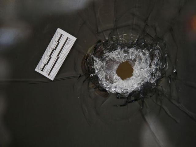A bullethole is seen in the window of a restaurant at the scene of a shooting incident in Tel Aviv, Israel January 1, 2016. (REUTERS) A bullethole is seen in the window of a restaurant at the scene of a shooting incident in Tel Aviv, Israel January 1, 2016. (REUTERS)