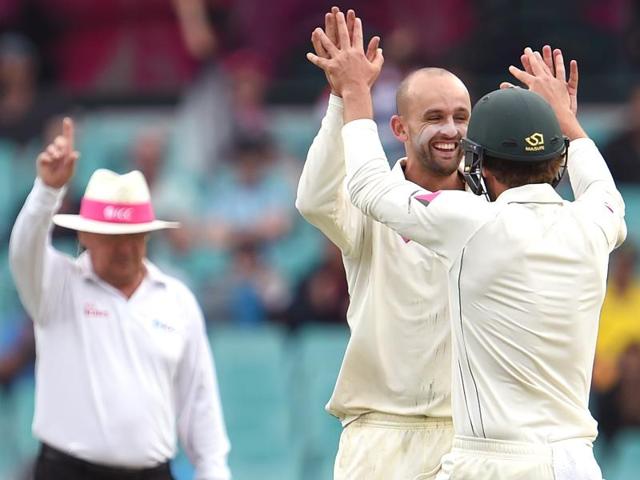 West Indies batsman Jermaine Blackwood walks past as Australia's Nathan Lyon celebrates with team mates. (AP Photo) West Indies batsman Jermaine Blackwood walks past as Australia's Nathan Lyon celebrates with team mates. (AP Photo)