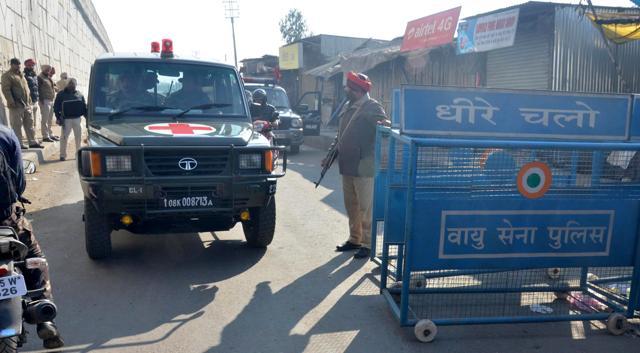 Security personnel keep a check on people passing by a check post on the road leading to the air force station in Pathankot. (Sameer Sehgal/ HT Photo) Security personnel keep a check on people passing by a check post on the road leading to the air force station in Pathankot. (Sameer Sehgal/ HT Photo)