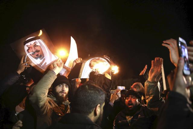 People protest in front of Saudi Arabia's embassy during a demonstration in Tehran January 2, 2016. Iranian protesters stormed the Saudi Embassy in Tehran early on Sunday morning. (REUTERS/TIMA/Mehdi Ghasemi/ISNA) People protest in front of Saudi Arabia's embassy during a demonstration in Tehran January 2, 2016. Iranian protesters stormed the Saudi Embassy in Tehran early on Sunday morning. (REUTERS/TIMA/Mehdi Ghasemi/ISNA)