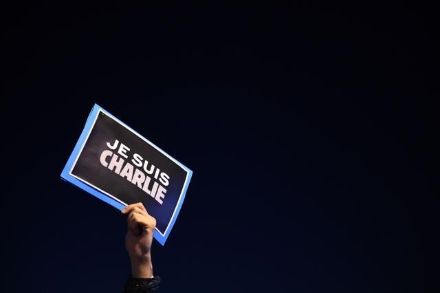 This file photo taken on January 07, 2015 shows a man holding a placard reading "I am Charlie" on the Old Harbor in Marseille, southern France. (AFP)