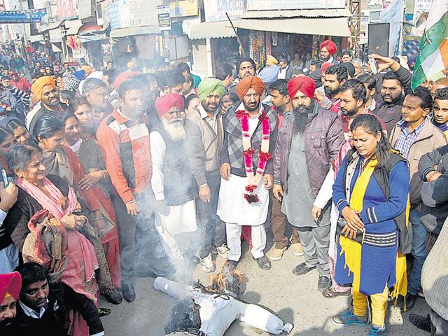 Congress workers burning an effigy of the SSP as they demanded his suspension, in Sangrur on Sunday. (HT file photo) Congress workers burning an effigy of the SSP as they demanded his suspension, in Sangrur on Sunday. (HT file photo)
