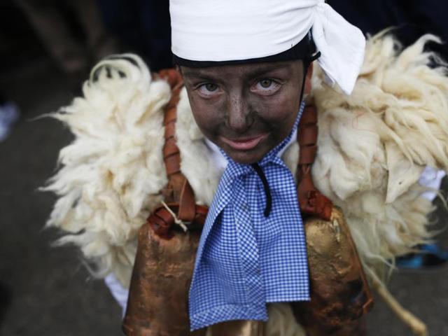 A young boy dressed in sheepskin with jingling bells to make noise poses for a photograph during the Vijanera Festival, in the small village of Silio, northern Spain, Sunday, January 3, 2016. (AP) A young boy dressed in sheepskin with jingling bells to make noise poses for a photograph during the Vijanera Festival, in the small village of Silio, northern Spain, Sunday, January 3, 2016. (AP)