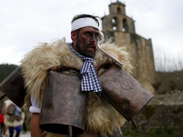 A man, so-called Zamarraco, dressed in sheepskins with jingling bells to make noise, marches with others during in Silio, northern Spain, Sunday, January 3, 2016. (AP) A man, so-called Zamarraco, dressed in sheepskins with jingling bells to make noise, marches with others during in Silio, northern Spain, Sunday, January 3, 2016. (AP)