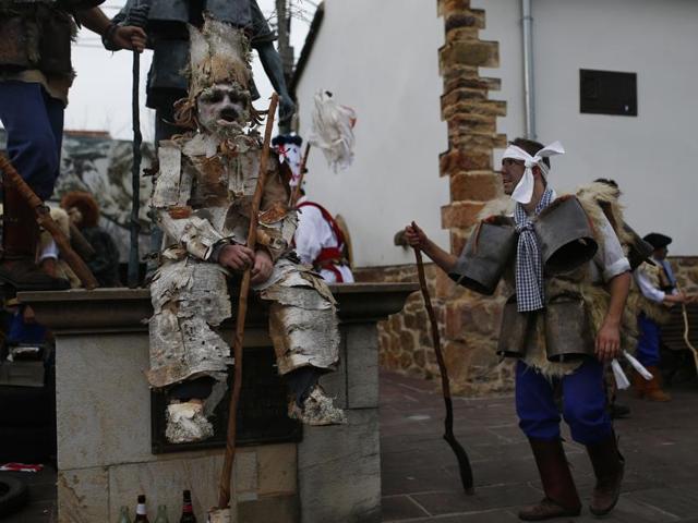 A man (right) dressed in sheepskins and jingling bells to make noise, dances next to another dressed as a Trapajon (left; entities of the nature) representing entities of nature, during the Vijanera Festival, in Silio, northern Spain, January 3, 2016. (AP) A man (right) dressed in sheepskins and jingling bells to make noise, dances next to another dressed as a Trapajon (left; entities of the nature) representing entities of nature, during the Vijanera Festival, in Silio, northern Spain, January 3, 2016. (AP)