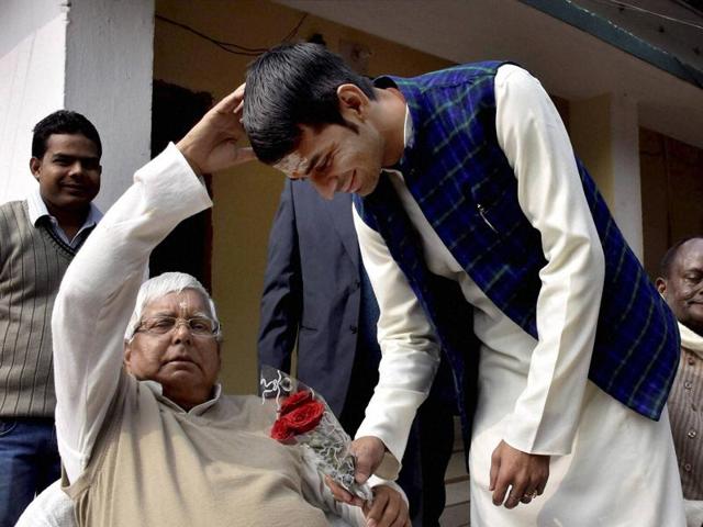 RJD chief Lalu Prasad giving blessings to his son and Bihar health minister Tej Pratap in Patna. (PTI) RJD chief Lalu Prasad giving blessings to his son and Bihar health minister Tej Pratap in Patna. (PTI)