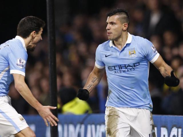 Manchester City's Argentinian striker Sergio Aguero celebrates with Manchester City's Spanish midfielder Jesus Navas after scoring their second goal. (AFP Photo)