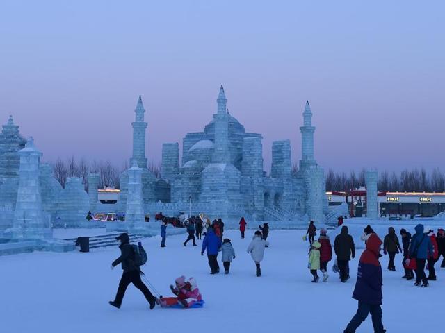 People visit the China Ice and Snow World on the eve of the opening ceremony. (AFP) People visit the China Ice and Snow World on the eve of the opening ceremony. (AFP)