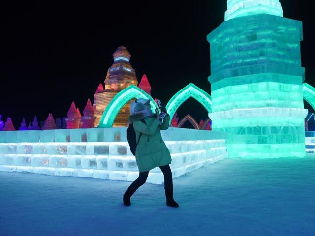 A woman uses a mobile phone to take a picture at the China Ice and Snow World on January 4, 2016. (AFP) A woman uses a mobile phone to take a picture at the China Ice and Snow World on January 4, 2016. (AFP)