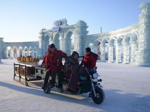 Harbin International Ice and Snow Festival is an annual winter festival that takes place in Harbin, China. It is considered world’s largest ice and snow festival. The festival begins in January first week and continues for a month. The festival originated as the traditional ice lantern show and garden party back in 1963. In this picture, vendors selling candied haws wait for customers at the China Ice and Snow World before the opening ceremony of the festival on January 4, 2016. Over one million visitors are expected to attend the spectacular festival, where buildings of ice are bathed in ethereal lights and international ice sculptors compete for honours. (AFP) Harbin International Ice and Snow Festival is an annual winter festival that takes place in Harbin, China. It is considered world’s largest ice and snow festival. The festival begins in January first week and continues for a month. The festival originated as the traditional ice lantern show and garden party back in 1963. In this picture, vendors selling candied haws wait for customers at the China Ice and Snow World before the opening ceremony of the festival on January 4, 2016. Over one million visitors are expected to attend the spectacular festival, where buildings of ice are bathed in ethereal lights and international ice sculptors compete for honours. (AFP)