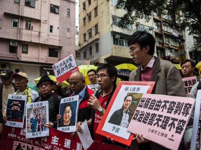 Protestors hold ‘missing person’ posters of publishers. Hong Kong police said late Monday that one of the five missing Hong Kong booksellers, Lee Bo’s wife cancelled the report, but that they would continue investigating the other cases. (AFP) Protestors hold ‘missing person’ posters of publishers. Hong Kong police said late Monday that one of the five missing Hong Kong booksellers, Lee Bo’s wife cancelled the report, but that they would continue investigating the other cases. (AFP)