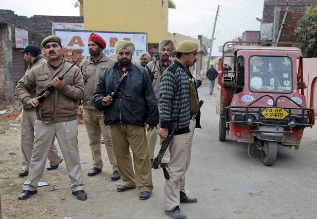 Policemen patrol near the Indian Air Force Base in Pathankot. The attack at the air base near the border with Pakistan began early Saturday morning . (AP) Policemen patrol near the Indian Air Force Base in Pathankot. The attack at the air base near the border with Pakistan began early Saturday morning . (AP)
