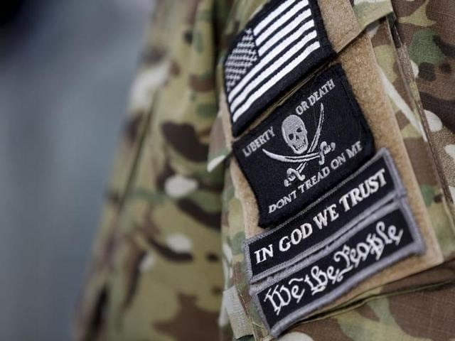 Patches on the sleeve of a militiaman is seen at the Malheur National Wildlife Refuge near Burns, Oregon, January 4, 2016. (REUTERS) Patches on the sleeve of a militiaman is seen at the Malheur National Wildlife Refuge near Burns, Oregon, January 4, 2016. (REUTERS)
