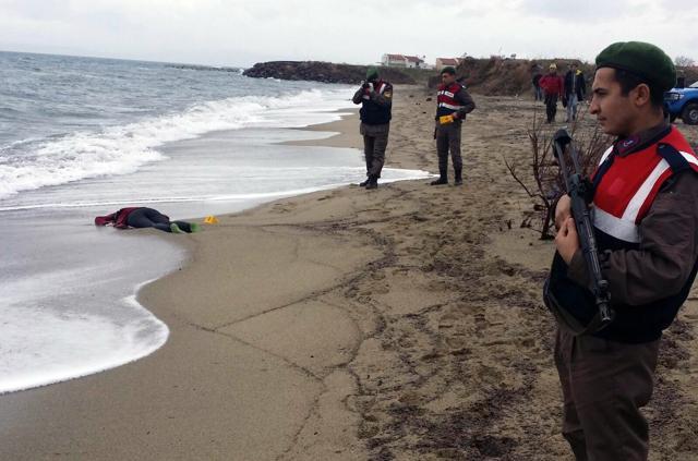 Paramilitary police officers investigate around the body of a migrant on the beach in Dikili, Izmir in Turkey on Tuesday. (AP) Paramilitary police officers investigate around the body of a migrant on the beach in Dikili, Izmir in Turkey on Tuesday. (AP)