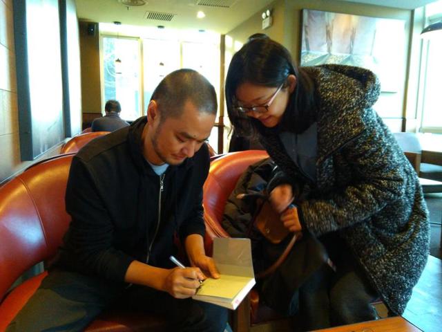 Feng Tang, signing an autograph at a coffee shop.(Sutirtho Patranobis/HT Photo) Feng Tang, signing an autograph at a coffee shop.(Sutirtho Patranobis/HT Photo)
