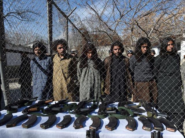 Pakistani Taliban fighters stand with their seized weapons as they are presented to the media in Kabul on January 5, 2016. (AFP) Pakistani Taliban fighters stand with their seized weapons as they are presented to the media in Kabul on January 5, 2016. (AFP)