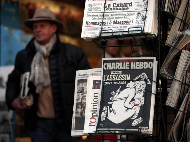 A copy of the latest edition of French weekly newspaper Charlie Hebdo with the title "One year on, The assassin still on the run" is displayed at a kiosk in Nice, France. (REUTERS) A copy of the latest edition of French weekly newspaper Charlie Hebdo with the title "One year on, The assassin still on the run" is displayed at a kiosk in Nice, France. (REUTERS)