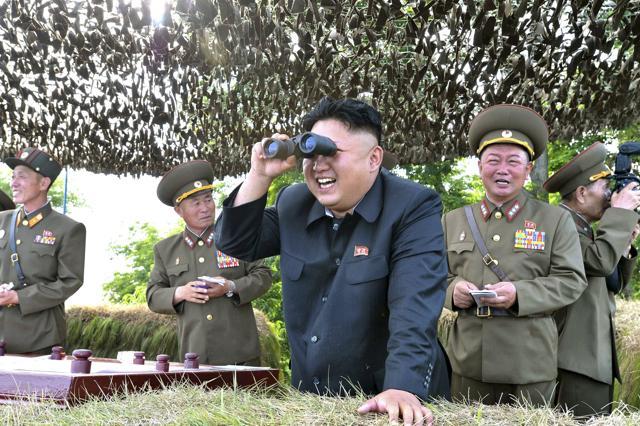 North Korean leader Kim Jong Un looks through a pair of binoculars during an inspection of the Hwa Islet Defence Detachment standing guard over a forward post off the east coast of the Korean peninsula. (REUTERS) North Korean leader Kim Jong Un looks through a pair of binoculars during an inspection of the Hwa Islet Defence Detachment standing guard over a forward post off the east coast of the Korean peninsula. (REUTERS)