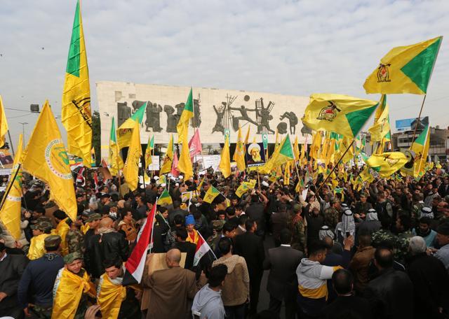 Protesters chant anti-Saudi slogans as they hold posters of Shia cleric Nimr al-Nimr and wave Shia militias flags and Iraqi flags to protest the execution of al-Nimr in Tahrir Square in Baghdad, Iraq on Wednesday. (AP) Protesters chant anti-Saudi slogans as they hold posters of Shia cleric Nimr al-Nimr and wave Shia militias flags and Iraqi flags to protest the execution of al-Nimr in Tahrir Square in Baghdad, Iraq on Wednesday. (AP)